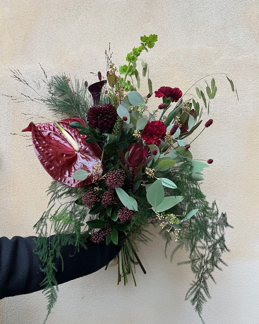 Vinterbuket med anthurium og grønt